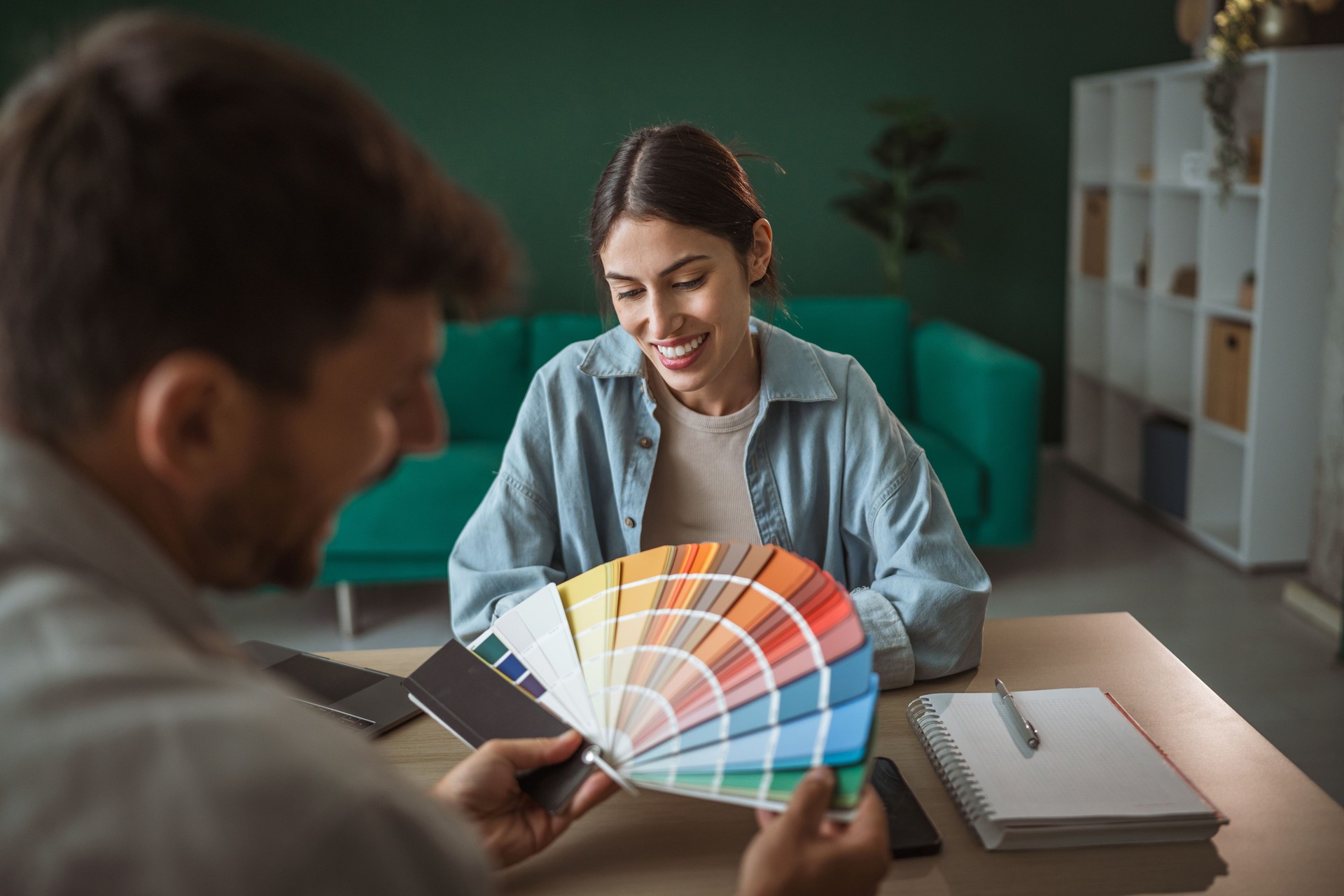 Interior designer discussing color palette with a client